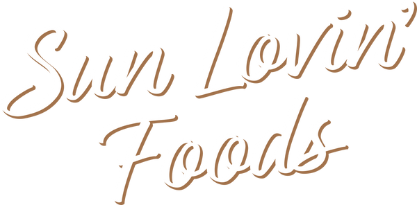 Sun Lovin' Foods logo in white with brown drop shadow